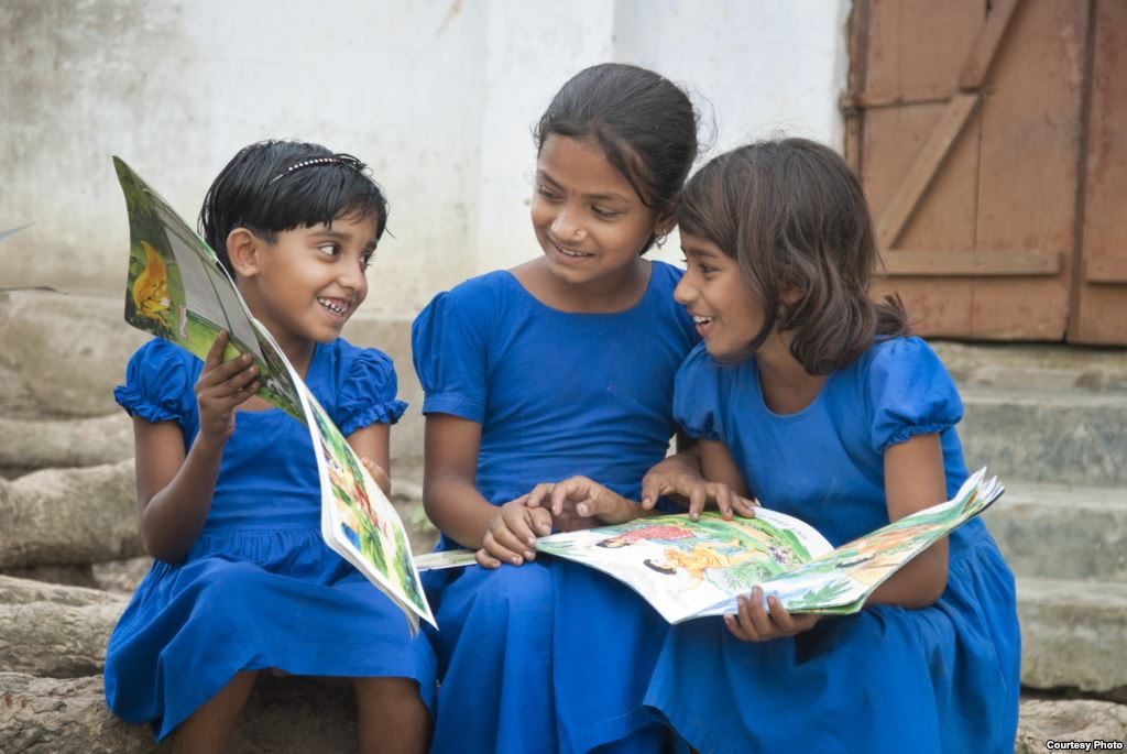 Girls reading together
