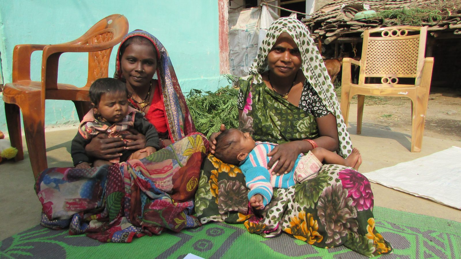 Mothers and babies in a village